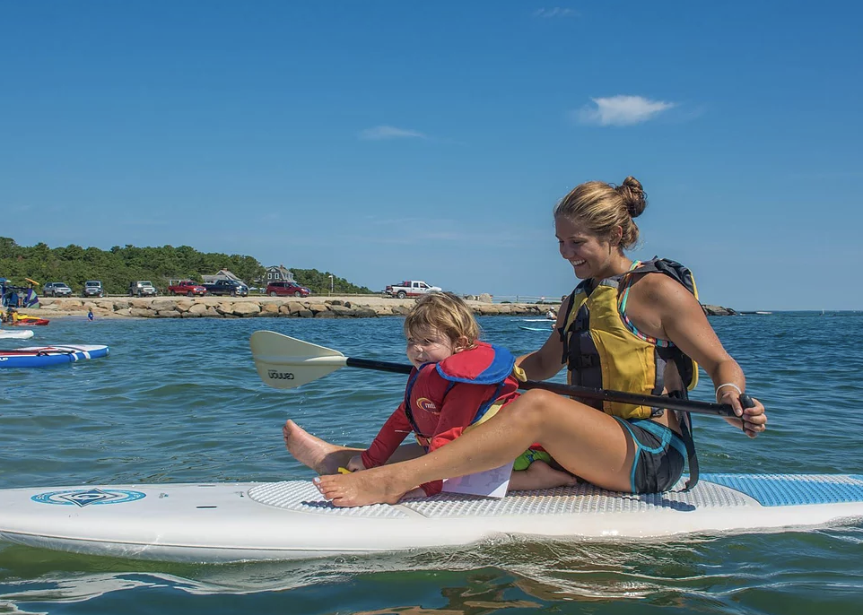 Kid and mom paddleboarding on Martha's Vineyard